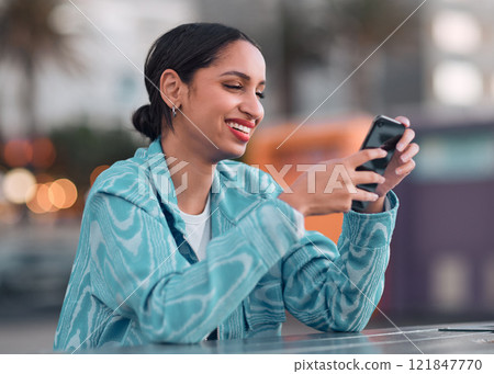 Happy woman texting on a phone, browsing social media or chatting on an instant, trendy and online chat app. Single female looking confident, reading a message on a dating website 121847770