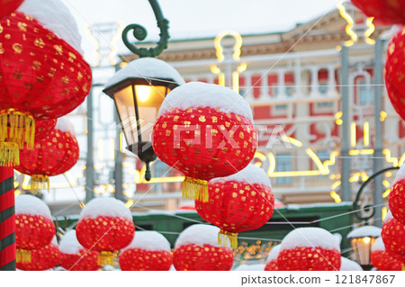 Chinese New Year. Red Chinese lanterns in snow. National Chinese New Year decorations on Christmas tree. Without people. Chinese New Year. Red Chinese lanterns in snow. National Chinese New Year decorations on Christmas tree. Without people. 121847867