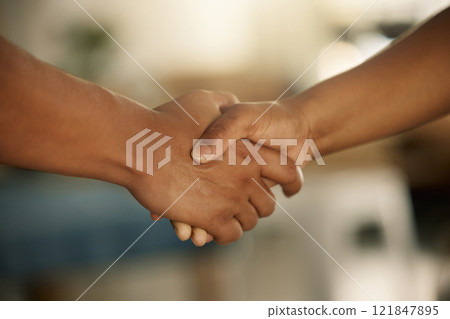 Teamwork, trust and support between a colleague, coworker or business partner. Closeup of two people sharing a hand shake. Professional manager welcoming, promoting or congratulating an employee Teamwork, trust and support between a colleague, coworker or business partner. Closeup of two people sharing a hand shake. Professional manager welcoming, promoting or congratulating an employee 121847895