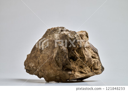 Close-Up Of a big Rock Against White Background 121848233