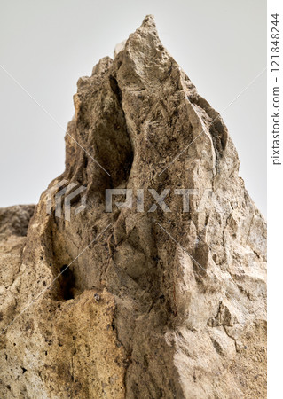 Close-Up Of a big Rock Against White Background 121848244