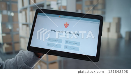 Tablet Screen Shows Delivery Tracking App Interface to Check Parcel Routing to Customer 121848398