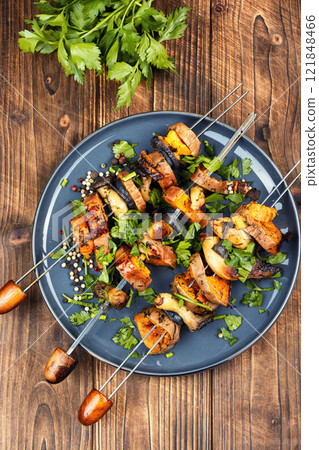 Tasty cooked sweet potato on skewers. Tasty cooked sweet potato on skewers. 121848466