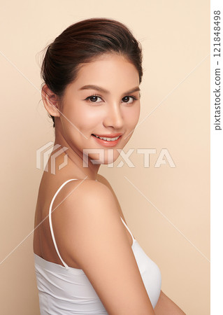 Beautiful young asian woman with clean fresh skin on beige background, Face care, Facial treatment, Cosmetology, beauty and spa, Asian women portrait. 121848498