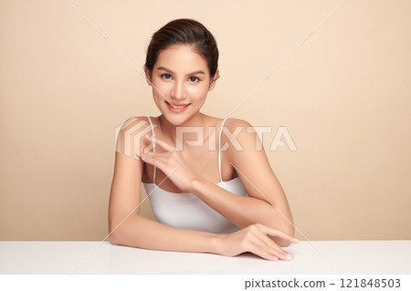 Beautiful young asian woman with clean fresh skin on beige background, Face care, Facial treatment, Cosmetology, beauty and spa, Asian women portrait. 121848503