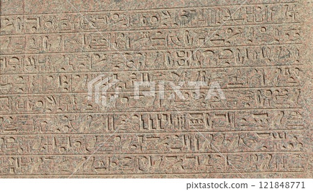 Ancient egyptian hieroglyphs engraved on the wall. 121848771