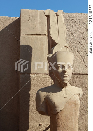 Half damaged statue of pharaoh at Karnak temple in Luxor, Egypt. 121848772