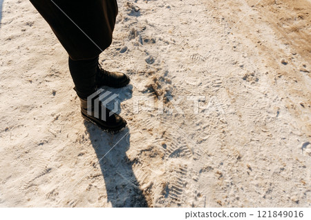 a sidewalk covered with snow in Kazakhstan. pedestrian sidewalk full of snow in Shymkent a sidewalk covered with snow in Kazakhstan. pedestrian sidewalk full of snow in Shymkent 121849016