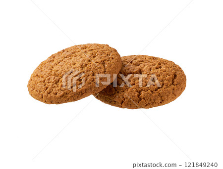 Two oatmeal cookies isolated. Round oatmeal cookies isolated on white background. Two oatmeal cookies isolated. Round oatmeal cookies isolated on white background. 121849240