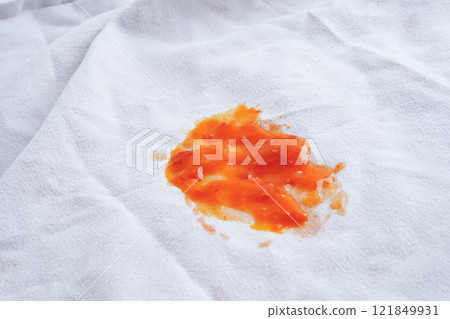 Dirty tomato sauce stain or ketchup on cloth to wash with washing powder, cleaning housework. Dirty tomato sauce stain or ketchup on cloth to wash with washing powder, cleaning housework. 121849931