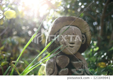 Jizo and a peaceful country road Jizo and a peaceful country road 121849941