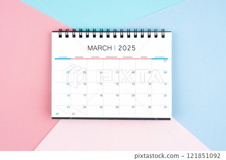March month desk calendar for 2025 year on colorful background. March month desk calendar for 2025 year on colorful background. 121851092