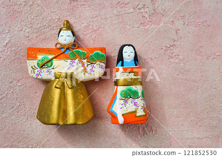 Hina dolls on a pink background (male on the left, female on the right) with copy space 121852530