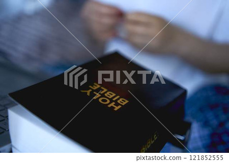 a senior woman attends online church, video conference with priest 121852555