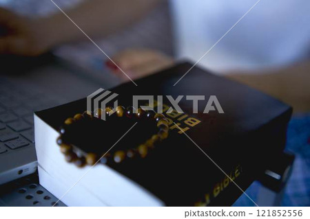 a senior woman attends online church, video conference with priest a senior woman attends online church, video conference with priest 121852556