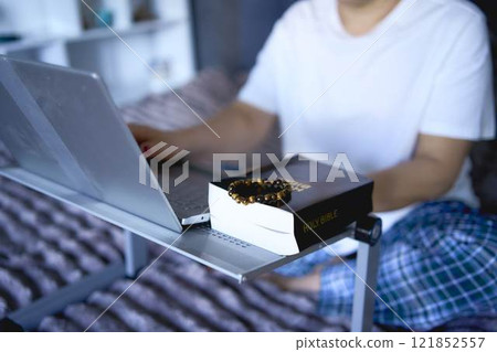 a senior woman attends online church, video conference with priest 121852557