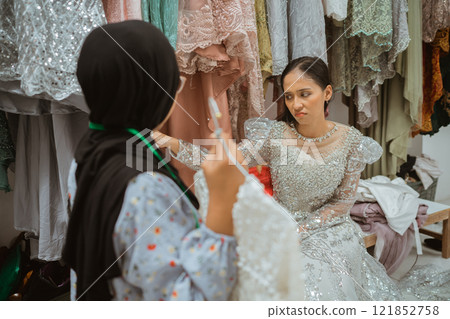 A Bridal Fitting Session held in a stylish Fashion Studio environment 121852758