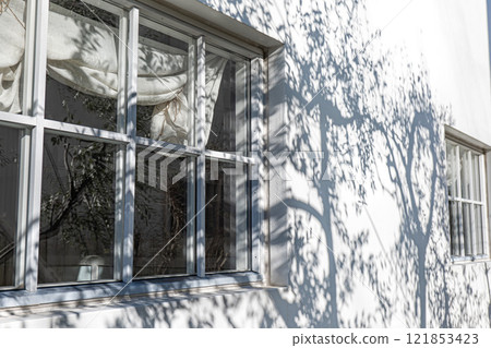 Simple white walls and wooden framed windows Simple white walls and wooden framed windows 121853423
