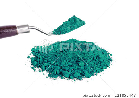 Vibrant Green Pigment Piled Next to a Scoop on a White Background Vibrant Green Pigment Piled Next to a Scoop on a White Background 121853448