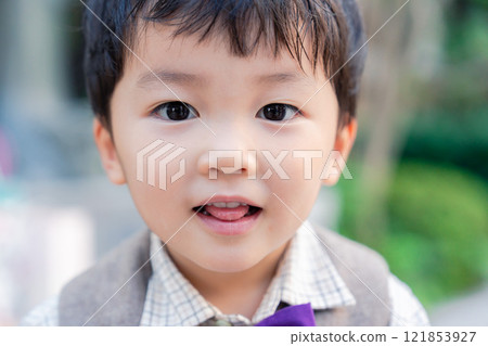 A little boy in stylish clothes 121853927