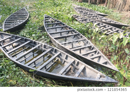 wooden boat on small lake 121854365