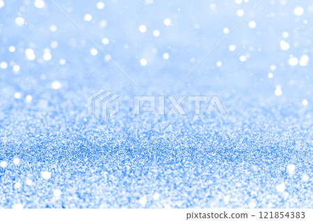 Shimmering blue bokeh background with sparkling light and festive atmosphere 121854383