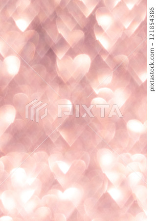 Pink abstract background with heart shaped bokeh lights creating a romantic vibe 121854386