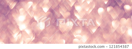 Romantic heart-shaped light bokeh background with soft pink and warm golden tones 121854387