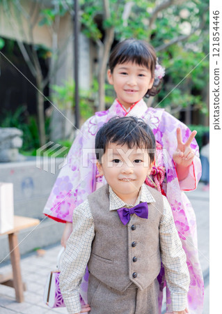 A 5-year-old girl visits a shrine for the Shichigosan festival with her younger brother A 5-year-old girl visits a shrine for the Shichigosan festival with her younger brother 121854446