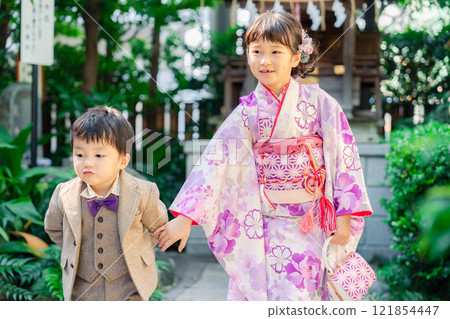 A 5-year-old girl visits a shrine for the Shichigosan festival with her younger brother A 5-year-old girl visits a shrine for the Shichigosan festival with her younger brother 121854447