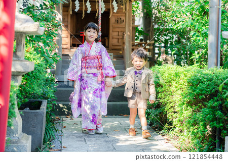 A 5-year-old girl visits a shrine for the Shichigosan festival with her younger brother A 5-year-old girl visits a shrine for the Shichigosan festival with her younger brother 121854448