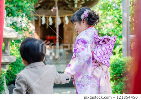 A 5-year-old girl visits a shrine for the Shichigosan festival with her younger brother A 5-year-old girl visits a shrine for the Shichigosan festival with her younger brother 121854450