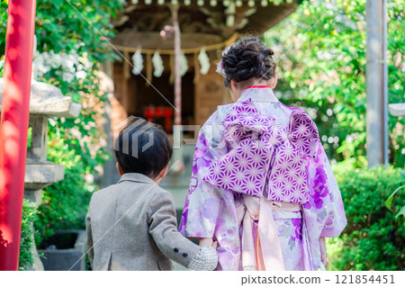 A 5-year-old girl visits a shrine for the Shichigosan festival with her younger brother A 5-year-old girl visits a shrine for the Shichigosan festival with her younger brother 121854451