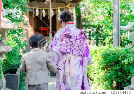 A 5-year-old girl visits a shrine for the Shichigosan festival with her younger brother A 5-year-old girl visits a shrine for the Shichigosan festival with her younger brother 121854453