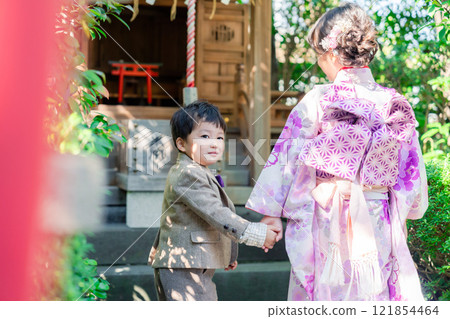A 5-year-old girl visits a shrine for the Shichigosan festival with her younger brother A 5-year-old girl visits a shrine for the Shichigosan festival with her younger brother 121854464