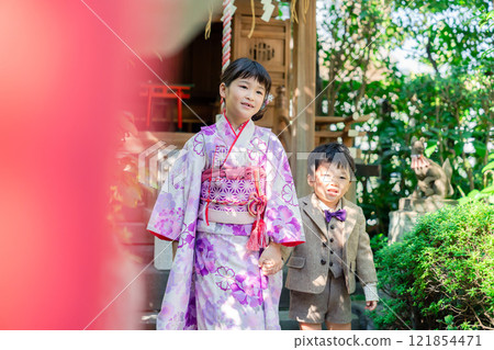 A 5-year-old girl visits a shrine for the Shichigosan festival with her younger brother A 5-year-old girl visits a shrine for the Shichigosan festival with her younger brother 121854471