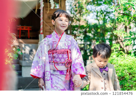 A 5-year-old girl visits a shrine for the Shichigosan festival with her younger brother A 5-year-old girl visits a shrine for the Shichigosan festival with her younger brother 121854476