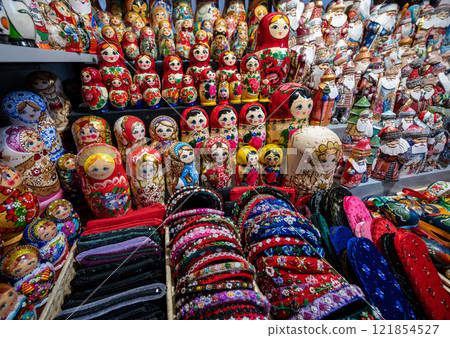 Budapest,Hungary. August 29,2022. Nice shot with a display of Russian dolls at the large central market. It is one of the most popular souvenirs, numerous varieties and colors. Budapest,Hungary. August 29,2022. Nice shot with a display of Russian dolls at the large central market. It is one of the most popular souvenirs, numerous varieties and colors. 121854527