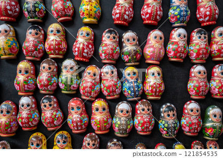 Budapest,Hungary. August 29,2022. Nice shot with a display of Russian dolls at the large central market. It is one of the most popular souvenirs, numerous varieties and colors. Budapest,Hungary. August 29,2022. Nice shot with a display of Russian dolls at the large central market. It is one of the most popular souvenirs, numerous varieties and colors. 121854535