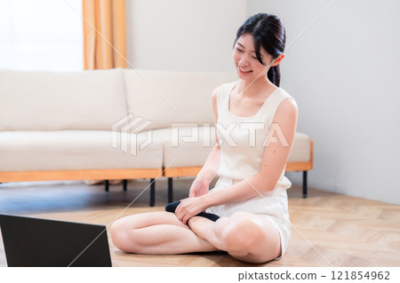 Young woman doing yoga, exercise and diet at home 121854962