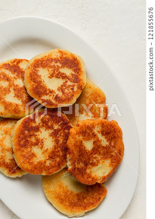 Chvishtari, corn flour tortillas with cheese, pastries, Georgian cuisine, Mchadi, homemade, top view, on a wooden table, no people, 121855676