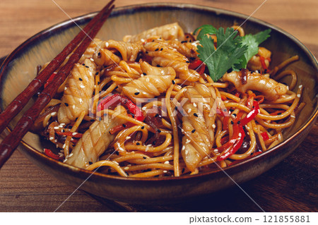 udon noodles, with squid and vegetables, on a wooden table, homemade, no people, 121855881