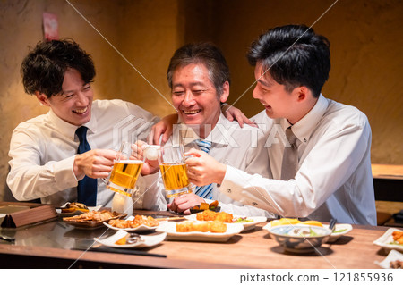 A businessman drinking with his boss at an izakaya A businessman drinking with his boss at an izakaya 121855936