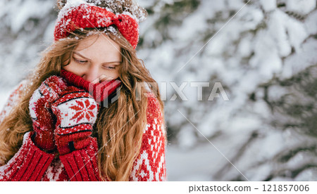 Woman Wearing Knitted Sweater in Winter Wonderland Woman Wearing Knitted Sweater in Winter Wonderland 121857006