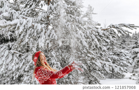 Women in Sweater Playing with Snow in Winter Forest Women in Sweater Playing with Snow in Winter Forest 121857008