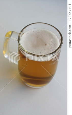 Full Glass Of Classic Lager Beer With Thin Layer Of Foam Stock Photo For Vertical Story  121857491
