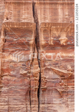 Remains of columns in the rock. Archaeological. site Petra in Jordan. 121859104