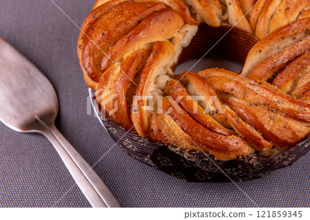 swedish cake with cardamom. Kanelbulle, swedish homemade cake on grey background. 121859345