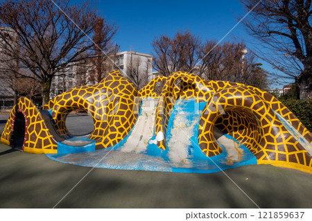 Playground equipment in a colorful park 121859637