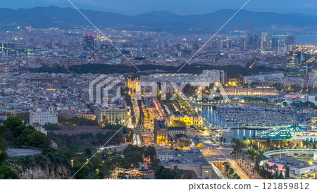 Aerial view over square Portal de la pau day to night timelapse in Barcelona, Catalonia, Spain. 121859812